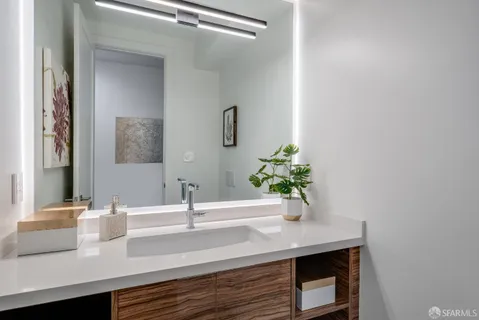 a bathroom with a sink and a mirror