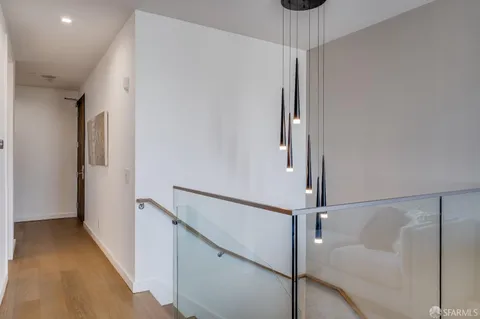a view of a hallway with a chandelier