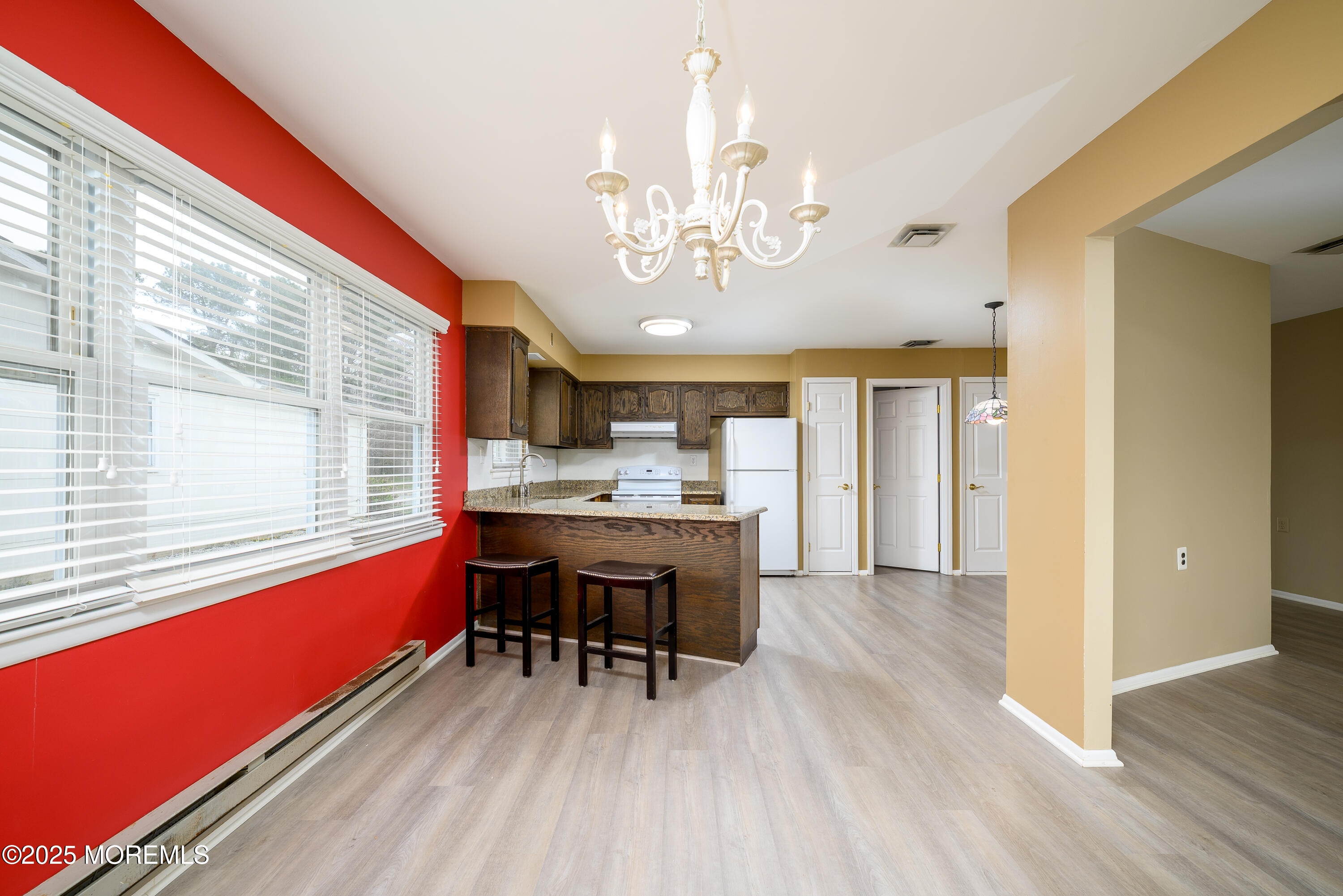 27 Blake Circle Brick, NJ 08724 - Photo 14 of 39 a view of a dining room with furniture and chandelier