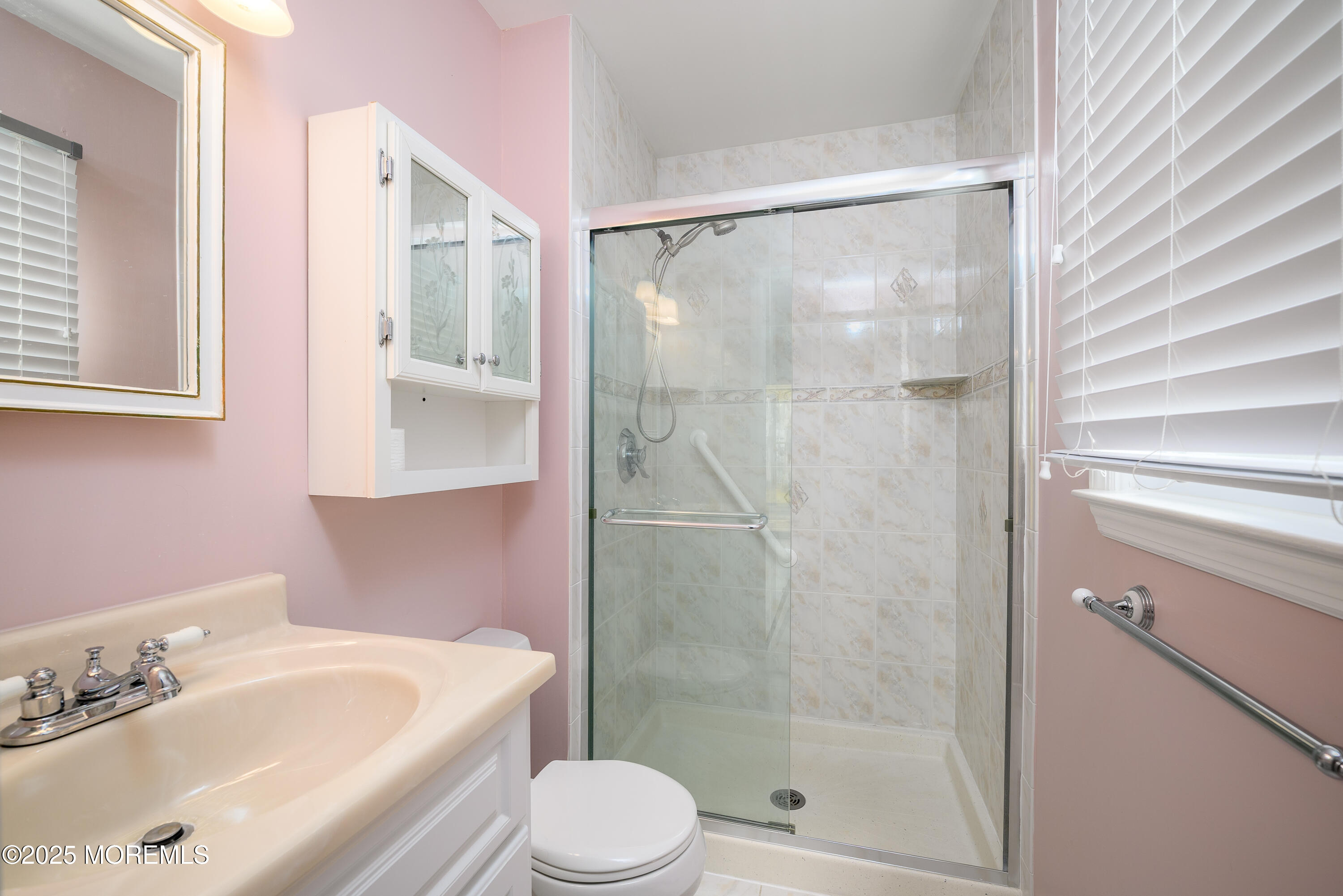 27 Blake Circle Brick, NJ 08724 - Photo 23 of 39 a bathroom with a bathtub shower sink vanity and toilet