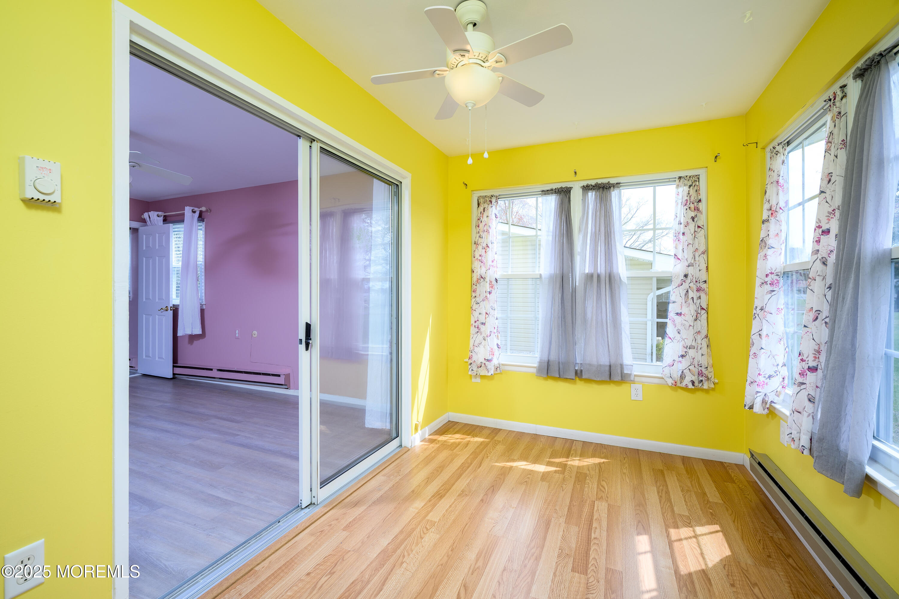 27 Blake Circle Brick, NJ 08724 - Photo 24 of 39 a view of empty room with window and wooden floor