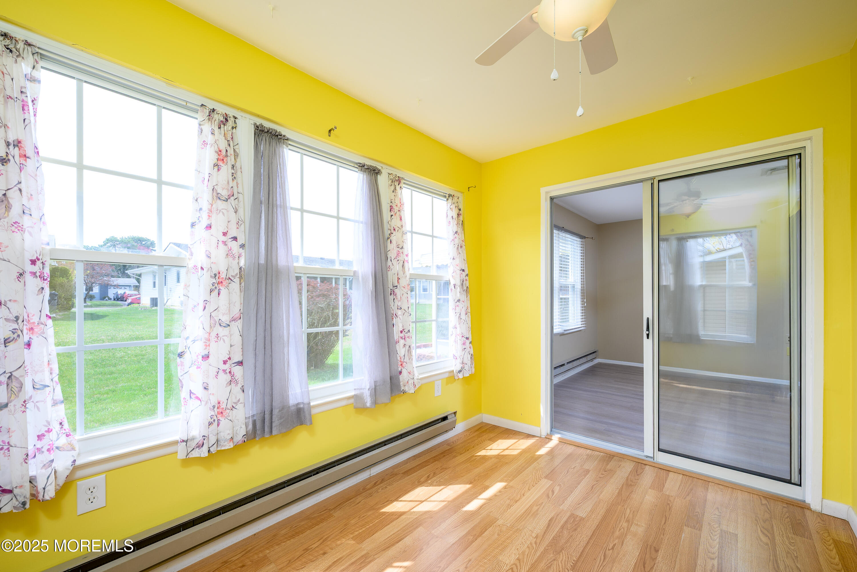 27 Blake Circle Brick, NJ 08724 - Photo 25 of 39 a view of an empty room with a window and wooden floor