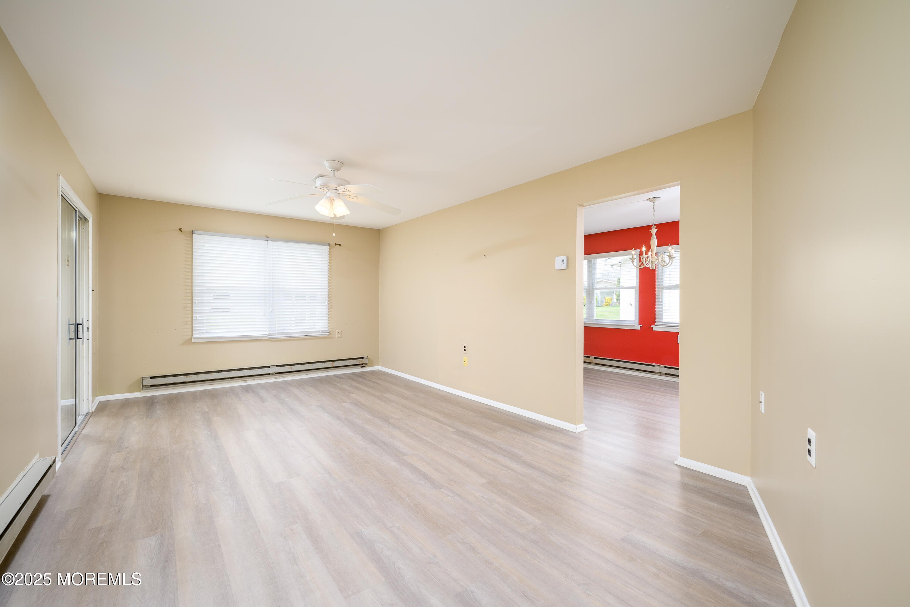 27 Blake Circle Brick, NJ 08724 - Photo 4 of 39 an empty room with wooden floor and windows