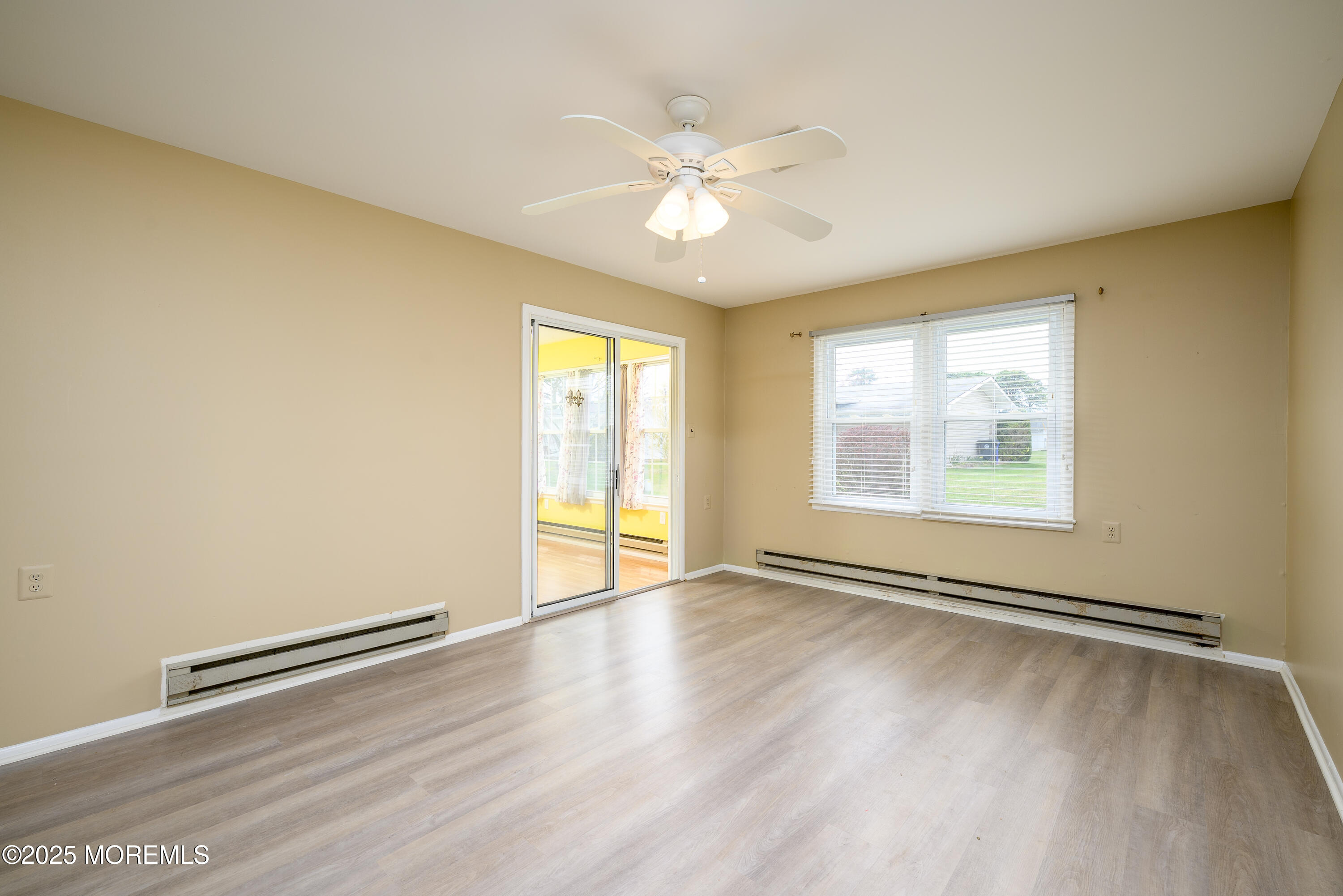 27 Blake Circle Brick, NJ 08724 - Photo 5 of 39 a view of an empty room with a window and wooden floor