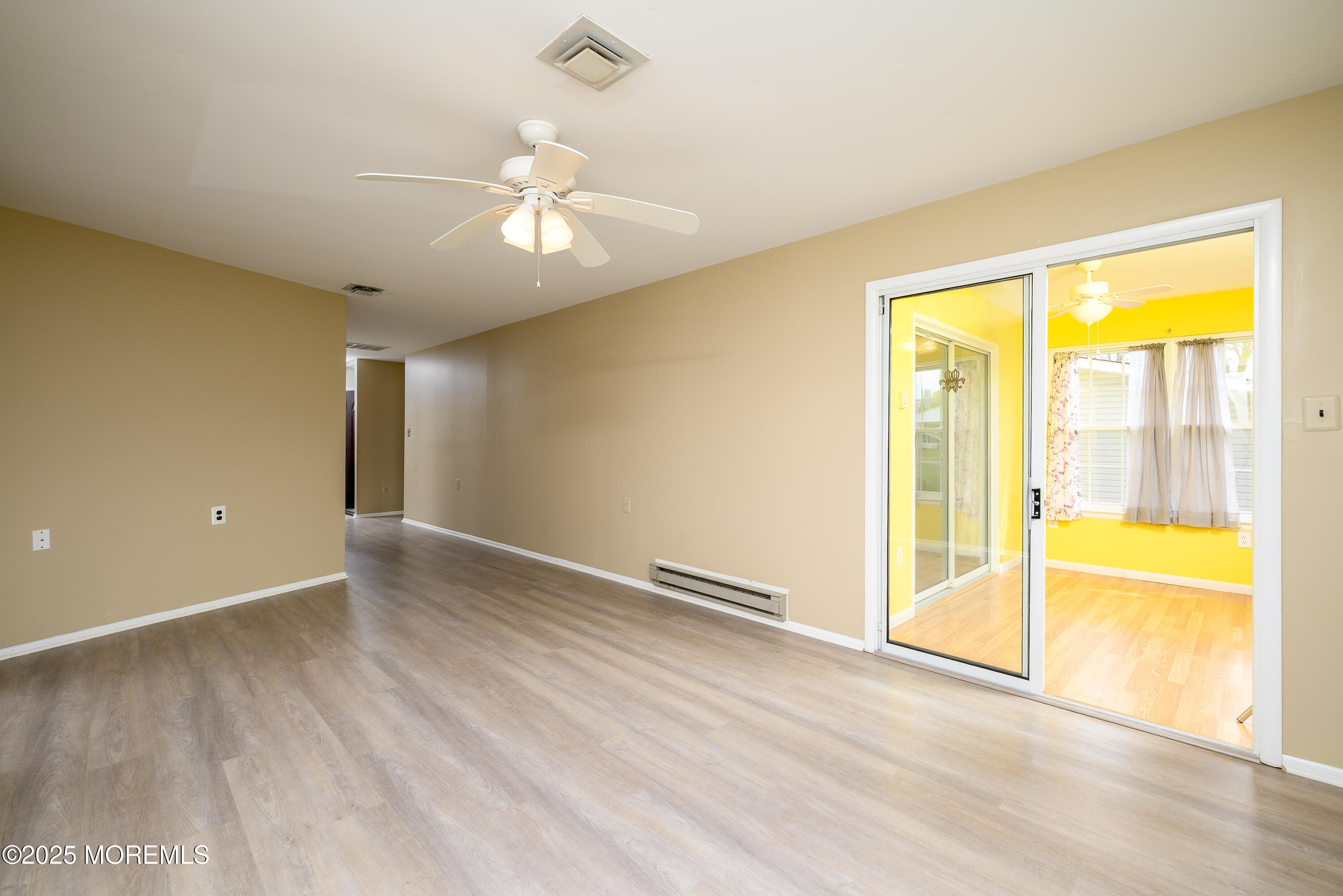 27 Blake Circle Brick, NJ 08724 - Photo 6 of 39 wooden floor in an empty room with a window