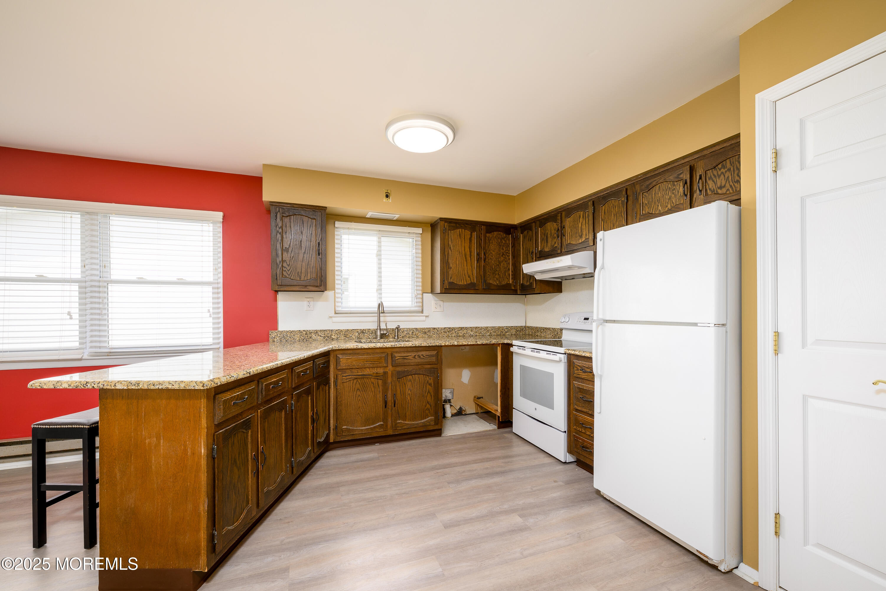 27 Blake Circle Brick, NJ 08724 - Photo 10 of 39 a kitchen with a refrigerator a stove top oven a sink and dishwasher