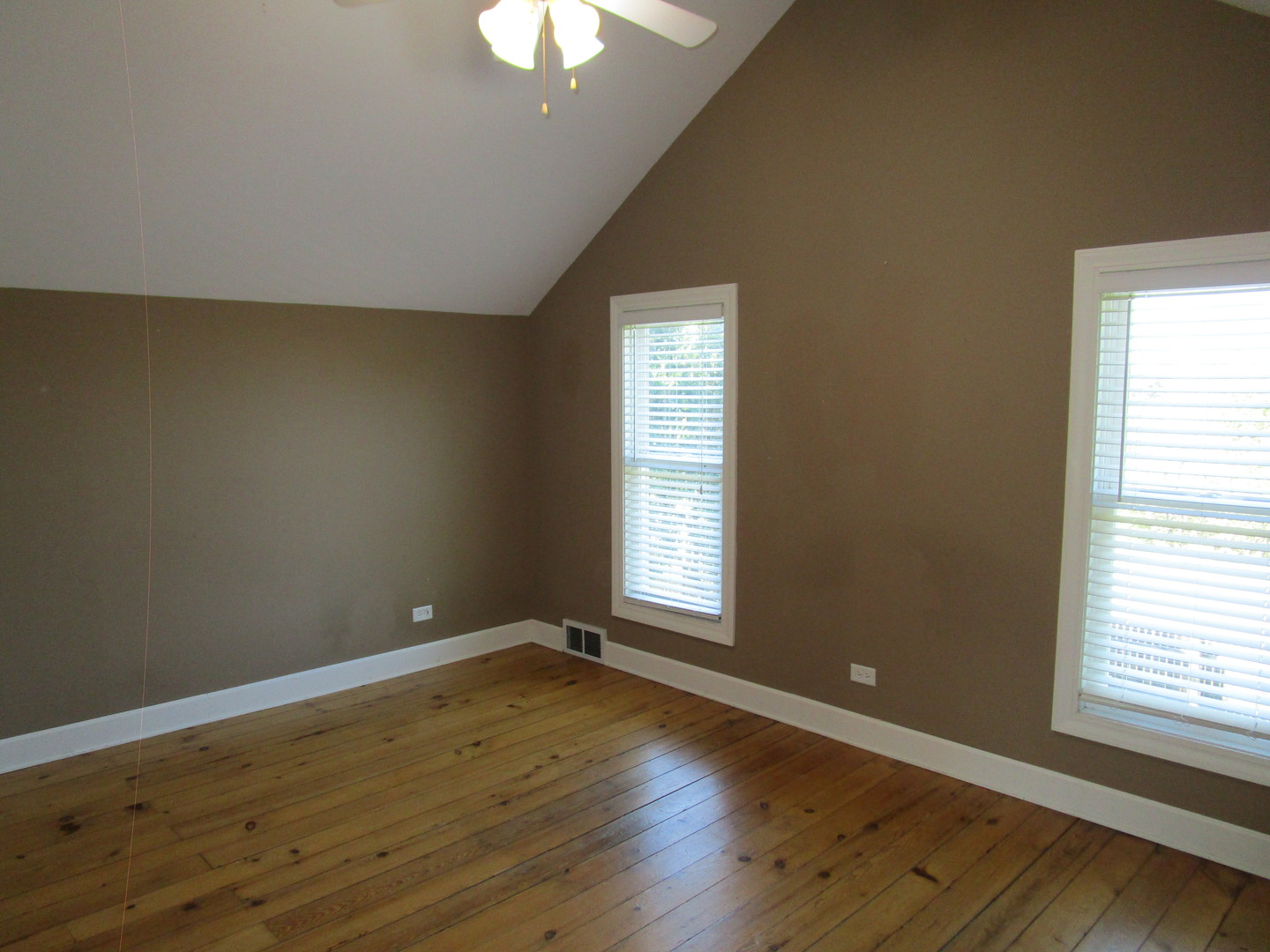 19882 McGuire Road Harvard, IL 60033 - Photo 14 of 17 an empty room with wooden floor and windows