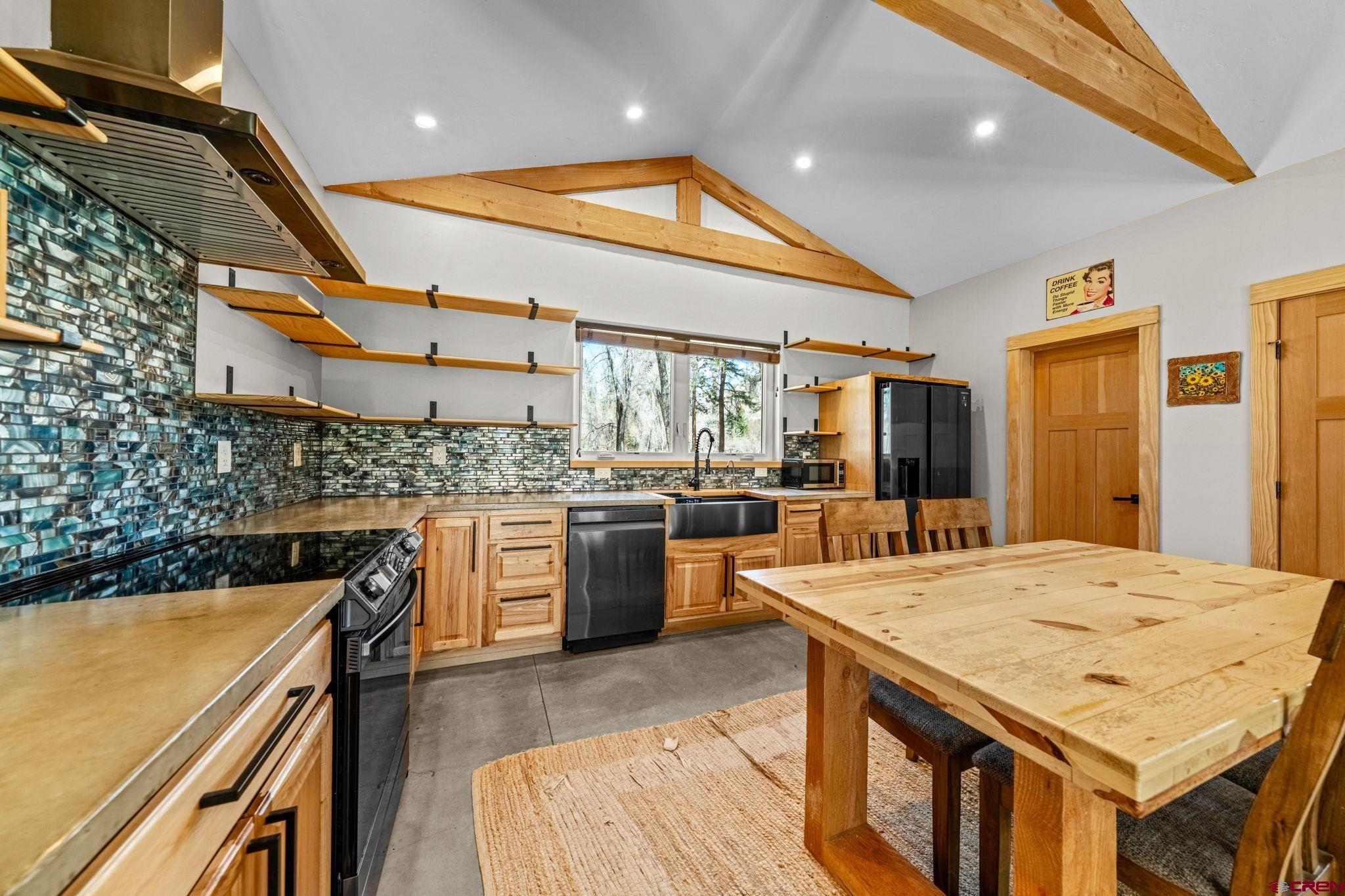 124 Richards Drive Bayfield, CO 81122 - Photo 11 of 42 a large kitchen with a table and chairs