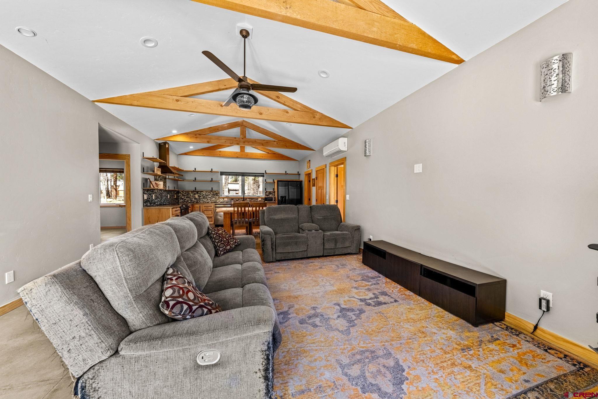 124 Richards Drive Bayfield, CO 81122 - Photo 15 of 42 a living room with furniture a ceiling fan and a rug