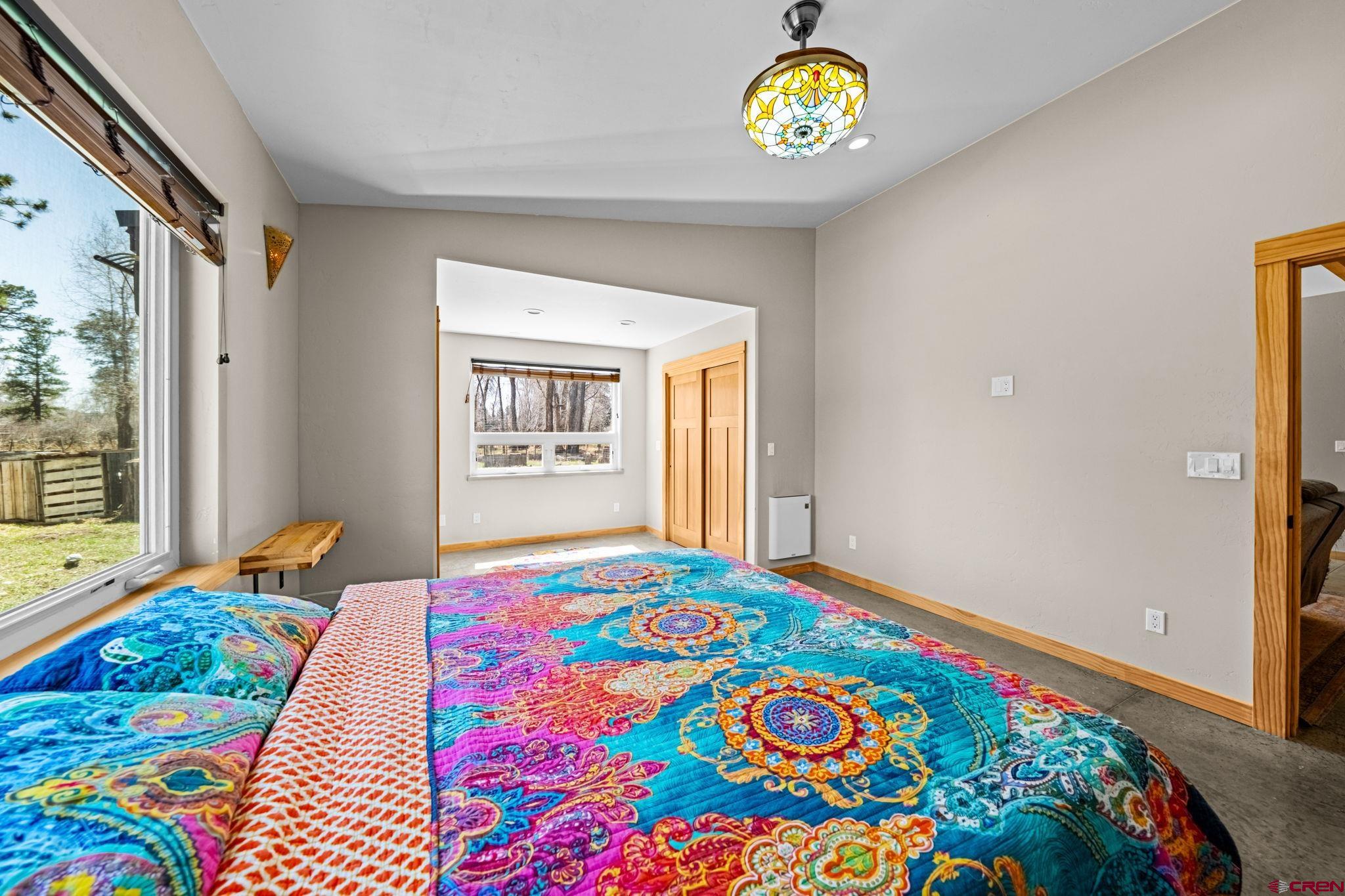 124 Richards Drive Bayfield, CO 81122 - Photo 18 of 42 a bedroom with a bed and a window