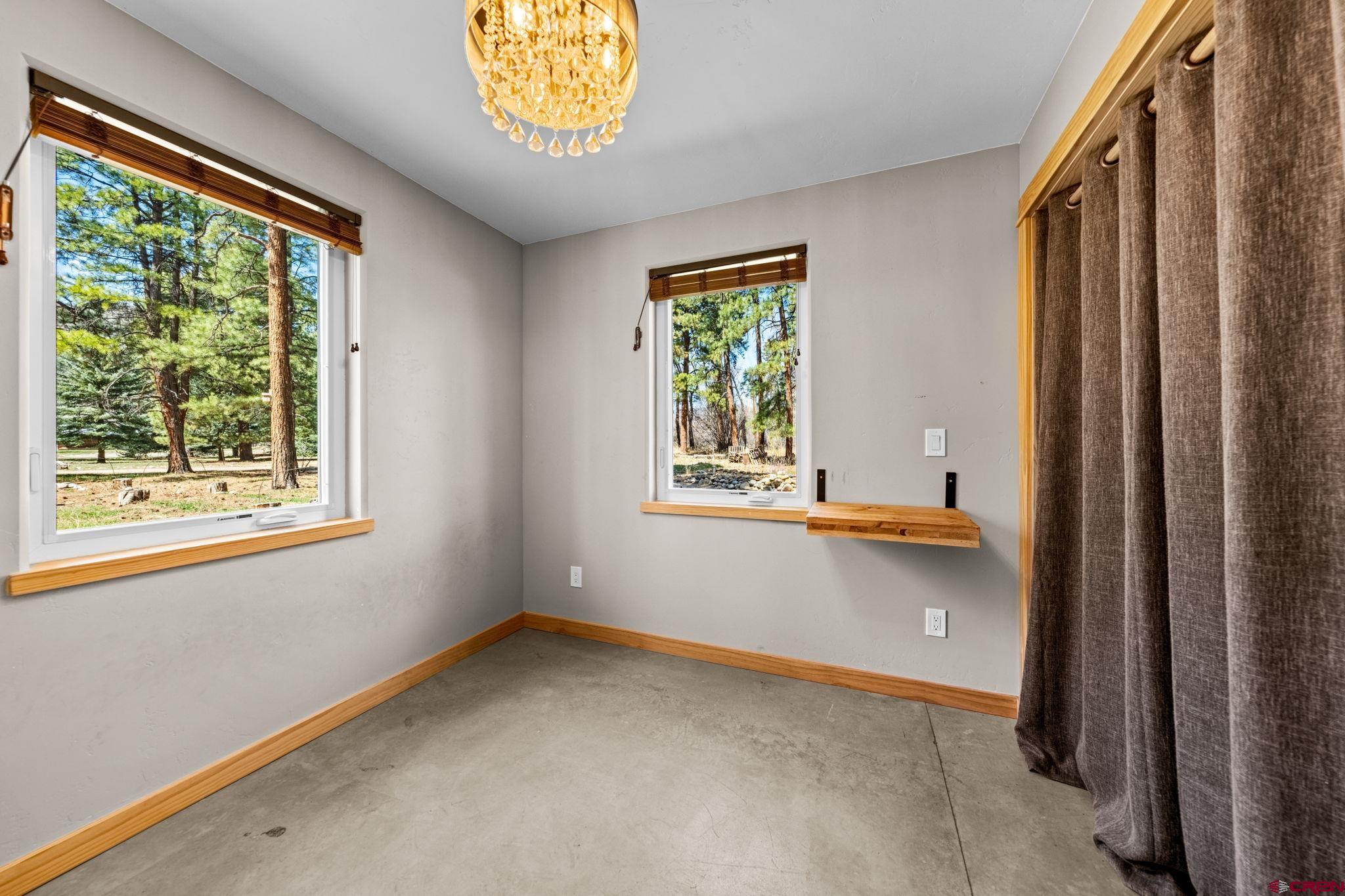 124 Richards Drive Bayfield, CO 81122 - Photo 25 of 42 a view of an empty room with a window