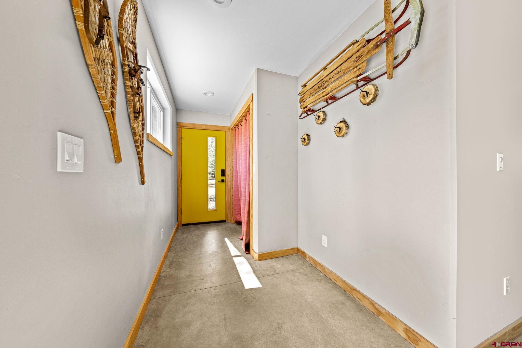 124 Richards Drive Bayfield, CO 81122 - Photo 28 of 42 a view of a hallway with wooden floor and stairs