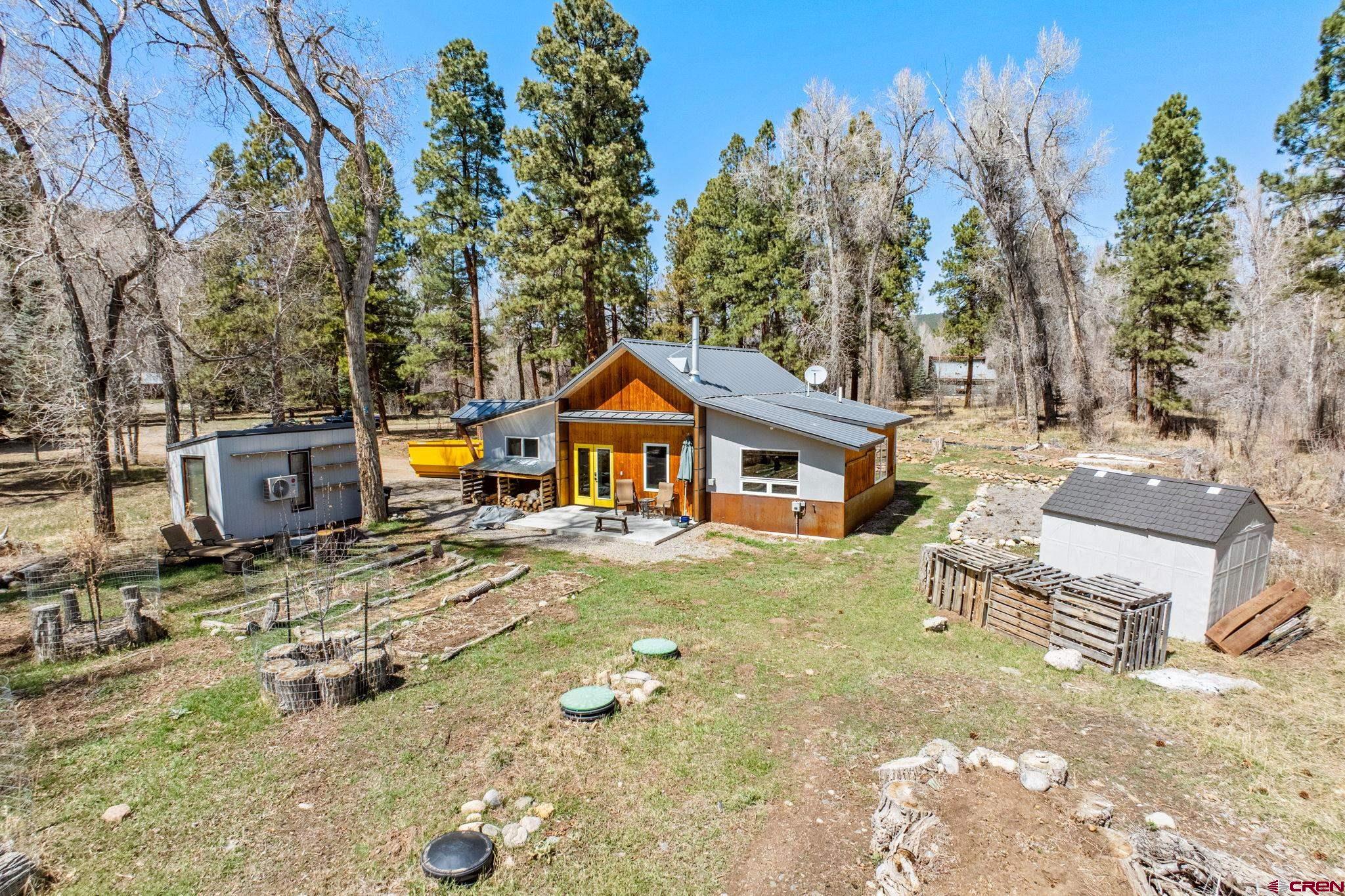 124 Richards Drive Bayfield, CO 81122 - Photo 3 of 42 a view of a house with backyard and sitting area