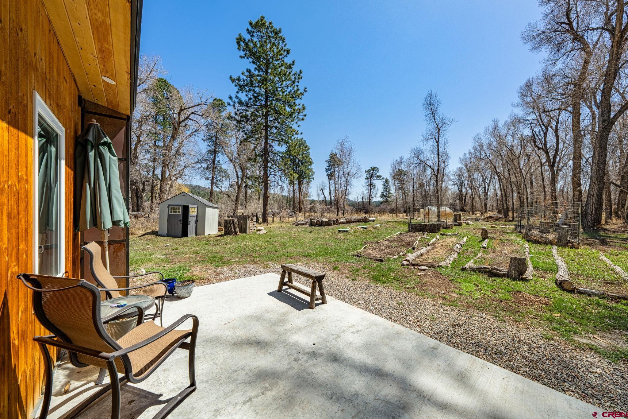 124 Richards Drive Bayfield, CO 81122 - Photo 34 of 42 a view of backyard with swimming pool and outdoor seating