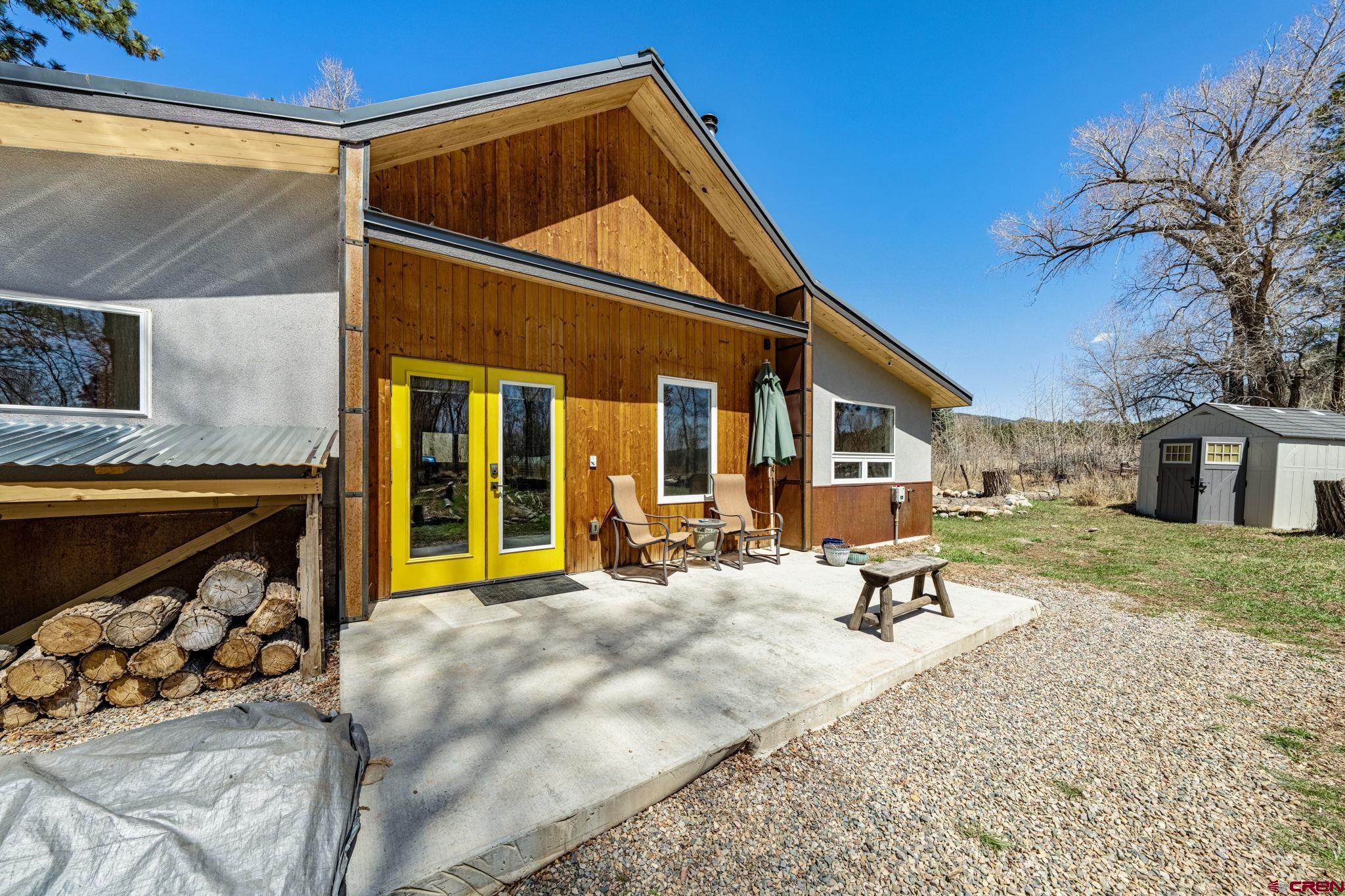 124 Richards Drive Bayfield, CO 81122 - Photo 4 of 42 a view of a house with backyard porch and sitting area