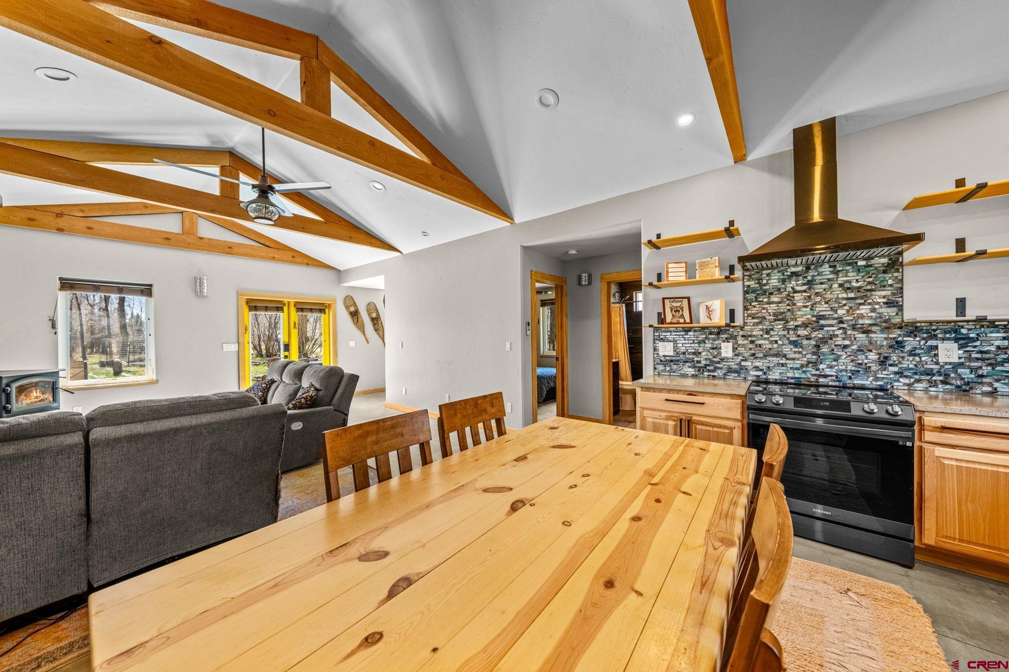 124 Richards Drive Bayfield, CO 81122 - Photo 8 of 42 a large kitchen with stainless steel appliances kitchen island granite countertop a sink and cabinets