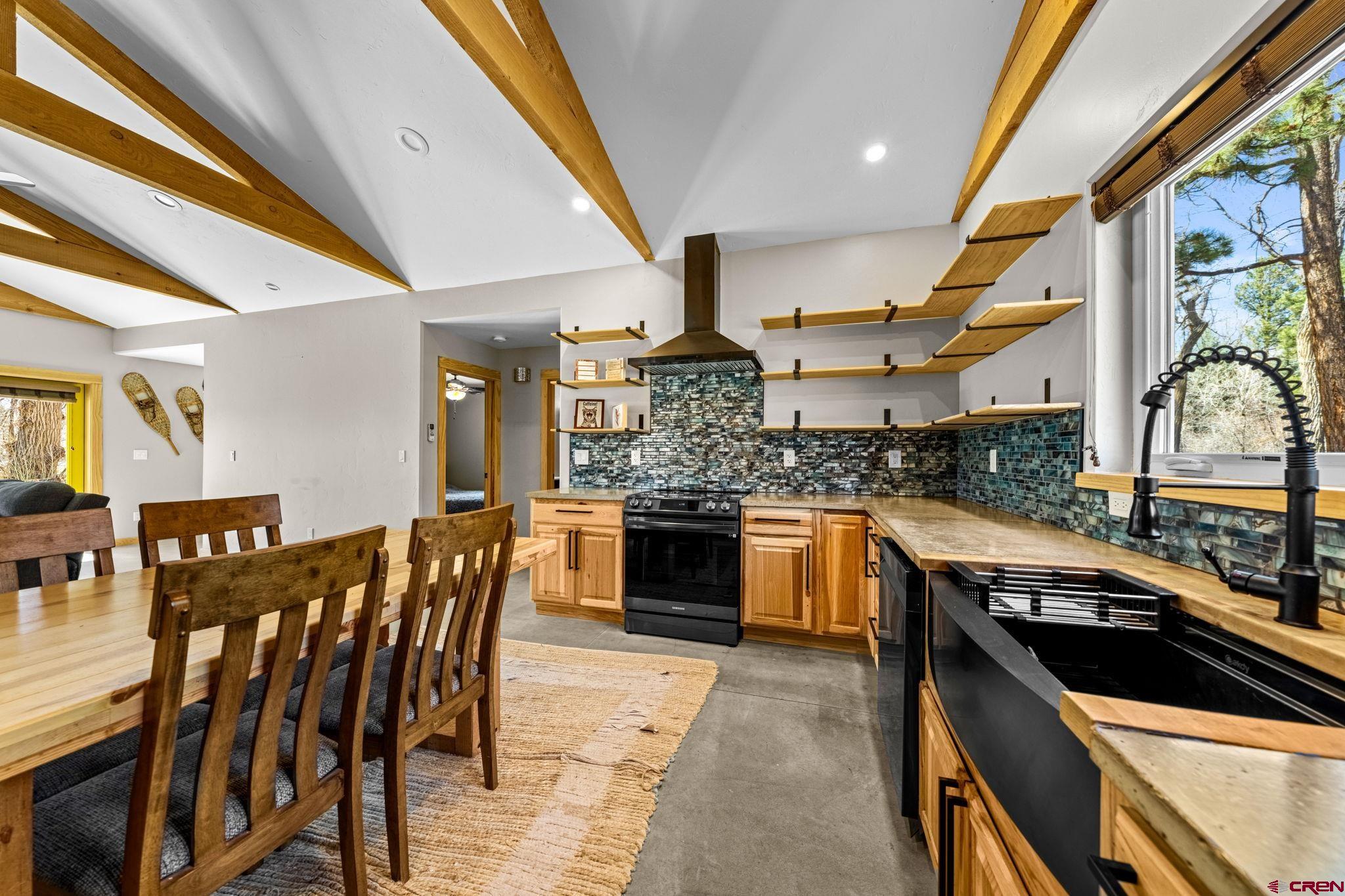 124 Richards Drive Bayfield, CO 81122 - Photo 10 of 42 a kitchen with stainless steel appliances granite countertop a stove and a sink