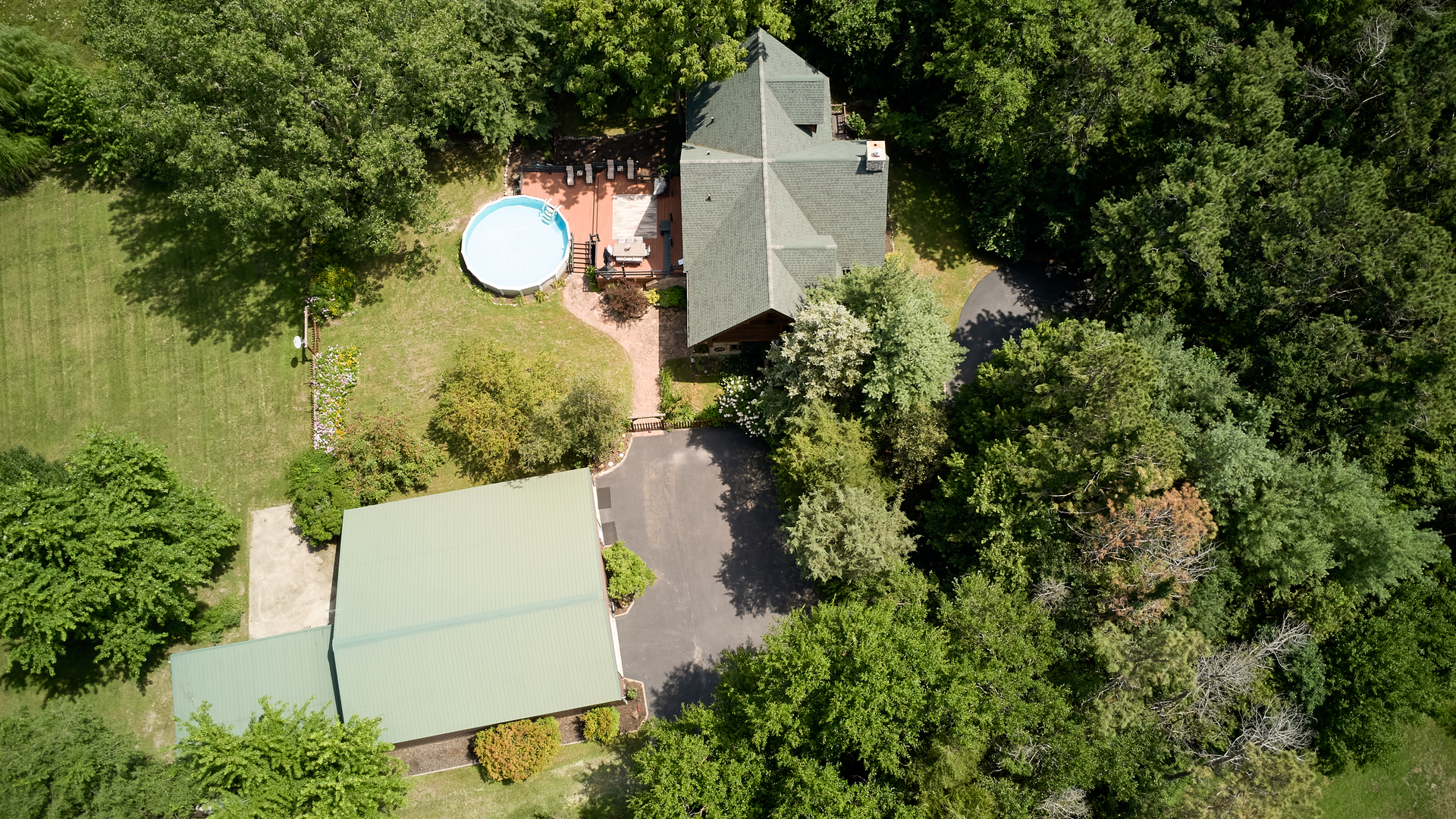 19542 Bauer Road Custer Park, IL 60481 - Photo 42 of 42 an aerial view of a house with a swimming pool and large trees