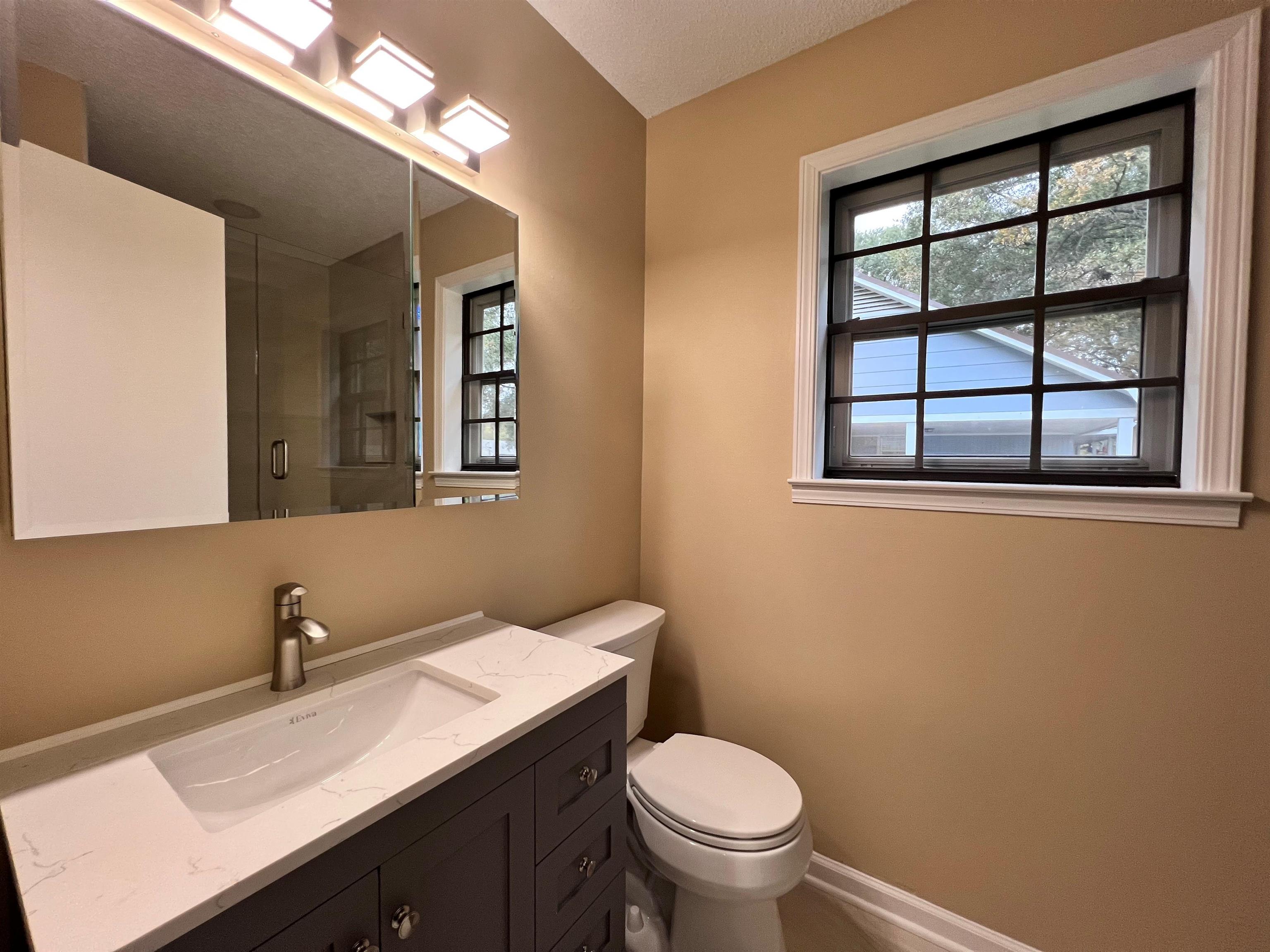 309 West Powell Road Collierville, TN 38017 - Photo 18 of 40 a bathroom with a sink and a toilet
