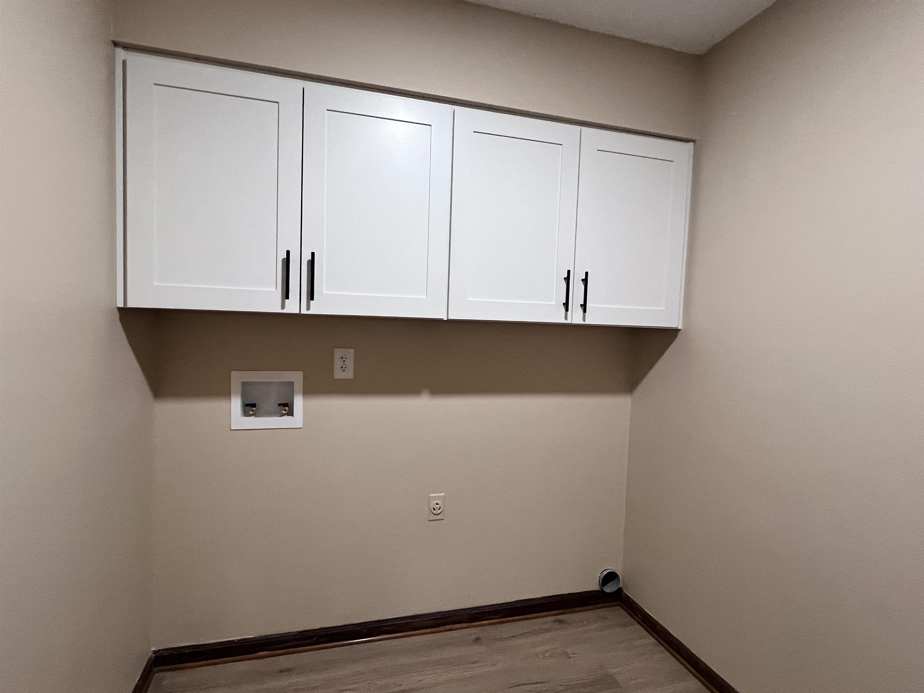 309 West Powell Road Collierville, TN 38017 - Photo 25 of 40 a view of storage and utility room with wooden floor