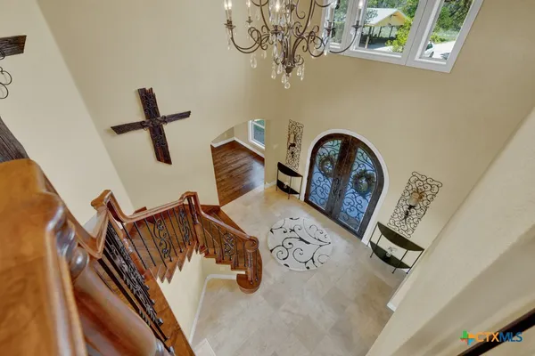 a bedroom with a bed dresser and a window