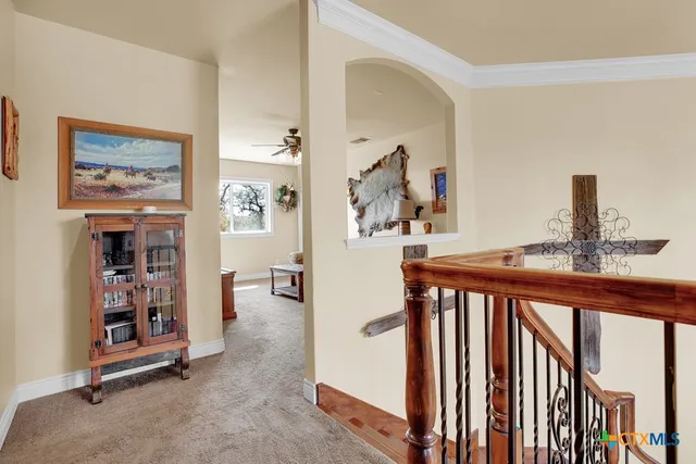 a view of a hallway with workspace and entryway