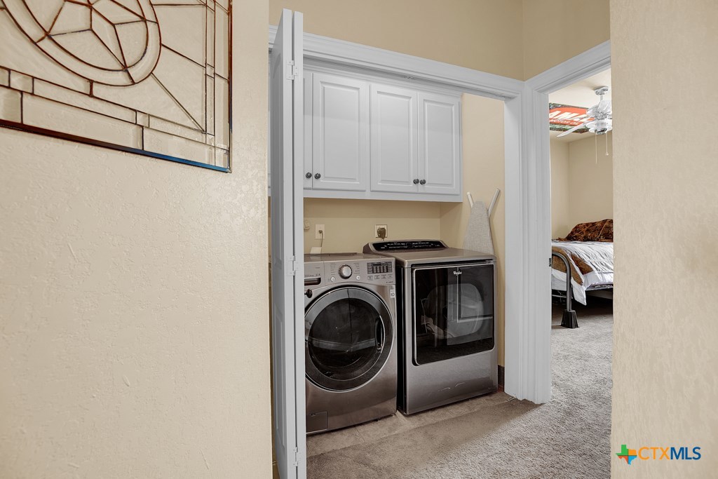 1262 Elm Creek Road New Braunfels, TX 78132 - Photo 39 of 48 a utility room with dryer and washer