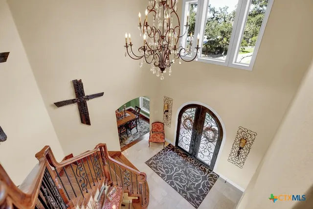 a view of entryway with a chandelier