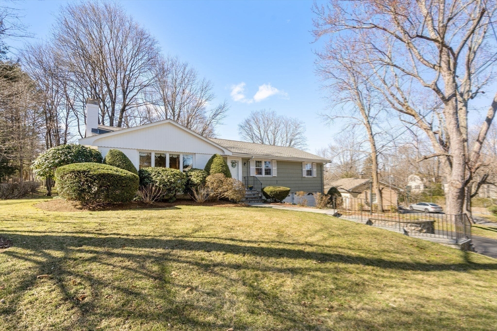 3 Tower Road Lexington, MA 02421 - Photo 1 of 38 a view of a house with a yard covered with snow in the yard