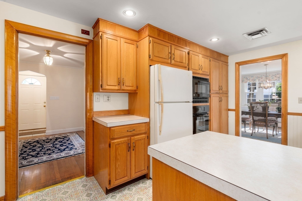 3 Tower Road Lexington, MA 02421 - Photo 14 of 38 a kitchen with a refrigerator a stove top oven and a large window