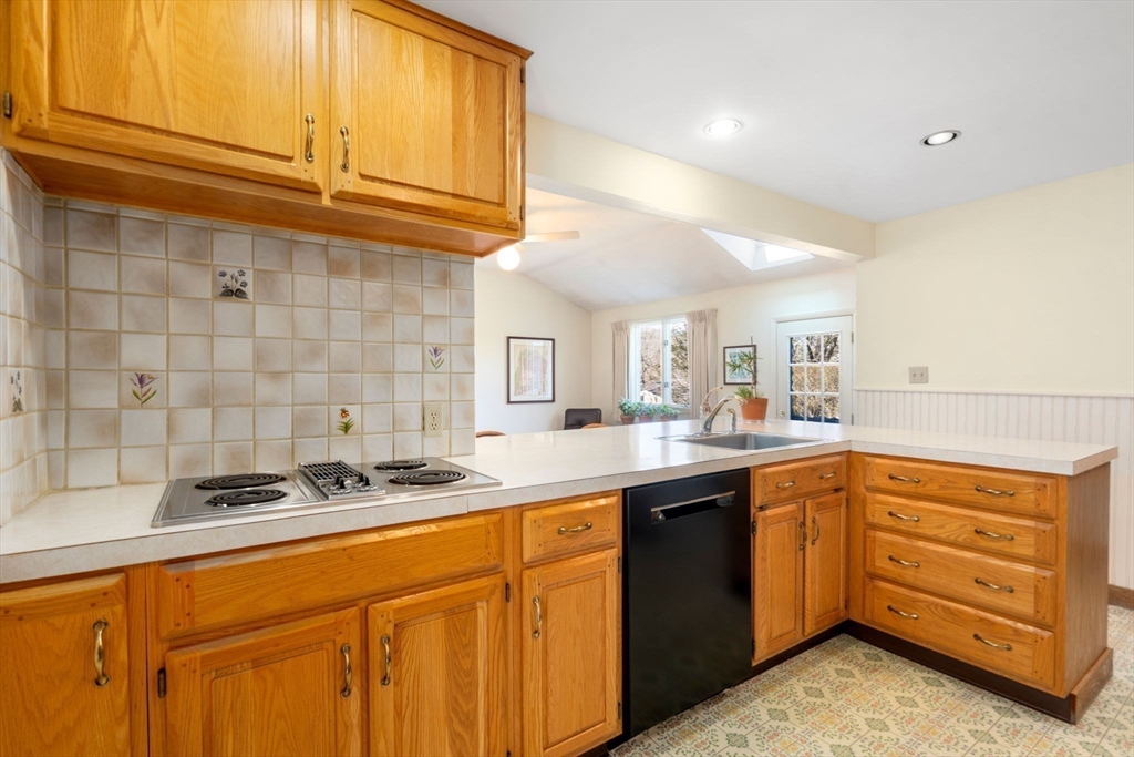 3 Tower Road Lexington, MA 02421 - Photo 16 of 38 a kitchen with stainless steel appliances granite countertop a sink and cabinets