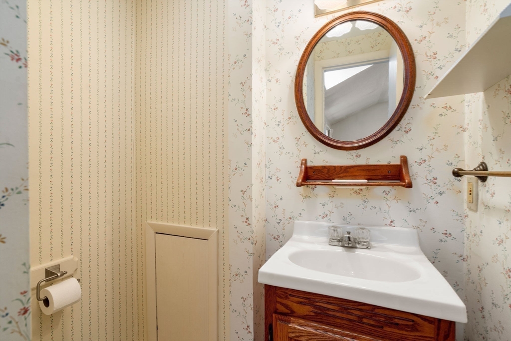 3 Tower Road Lexington, MA 02421 - Photo 19 of 38 a bathroom with a sink and a mirror