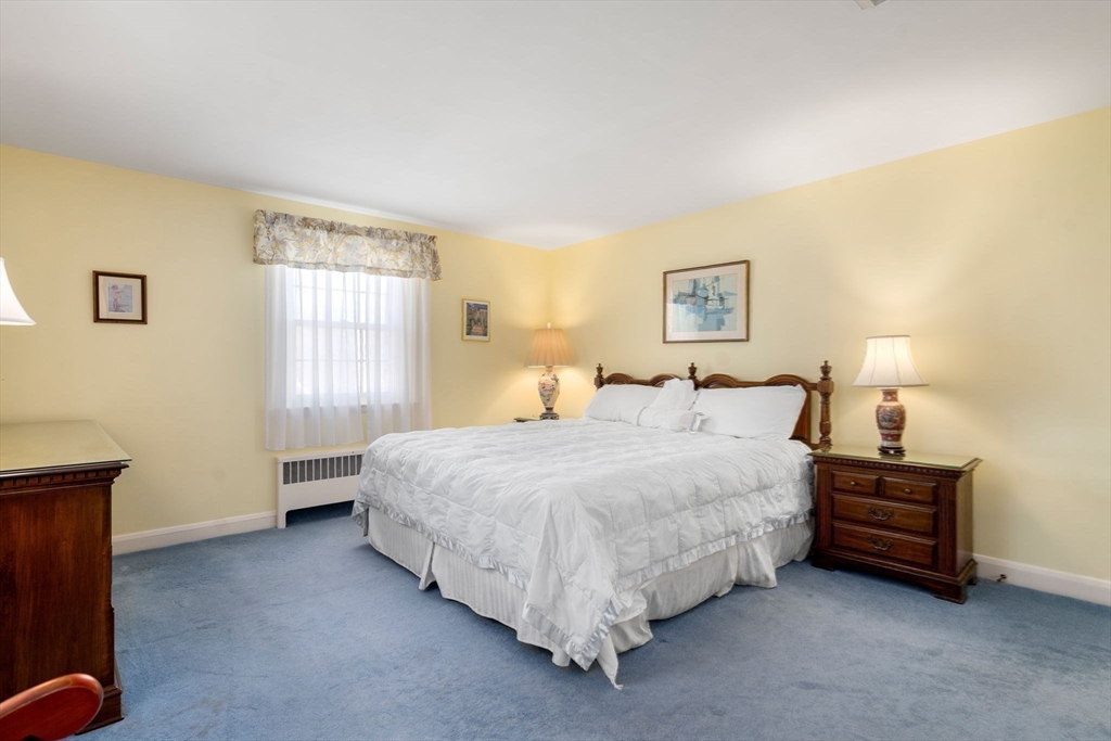3 Tower Road Lexington, MA 02421 - Photo 22 of 38 a spacious bedroom with a bed and a window