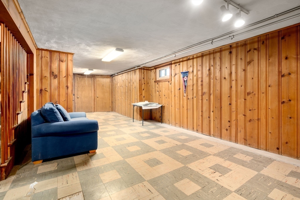 3 Tower Road Lexington, MA 02421 - Photo 33 of 38 a living room with furniture and a chandelier