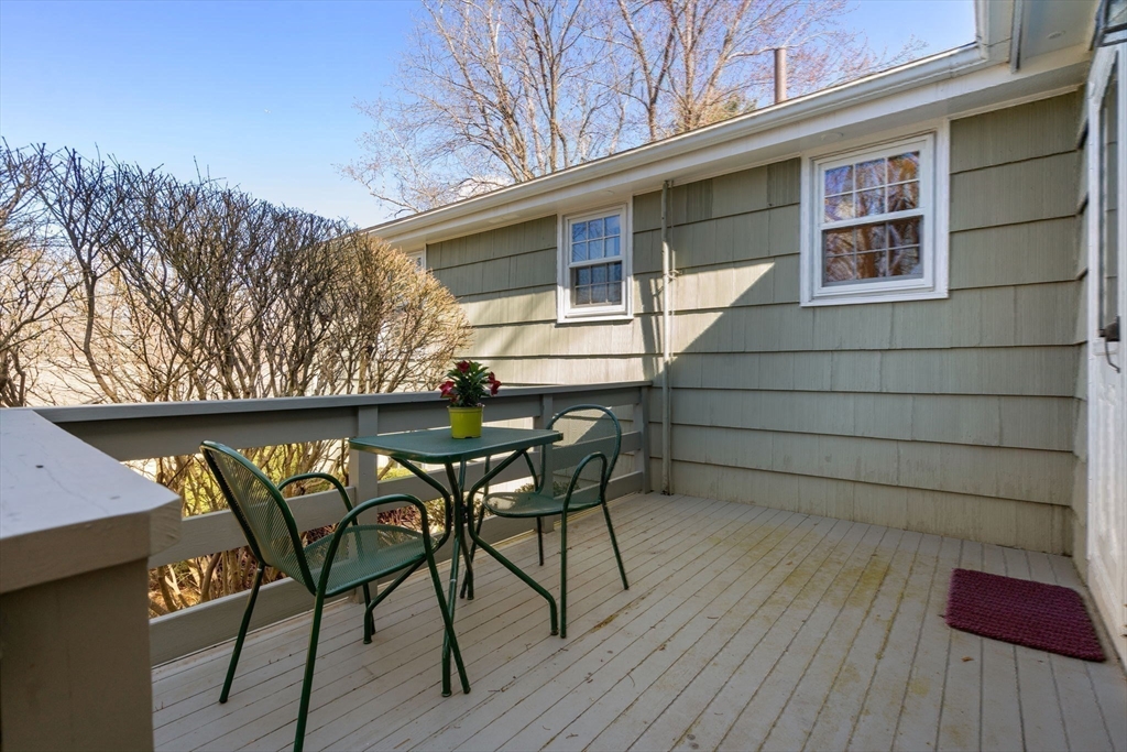 3 Tower Road Lexington, MA 02421 - Photo 34 of 38 a backyard of a house with table and chairs