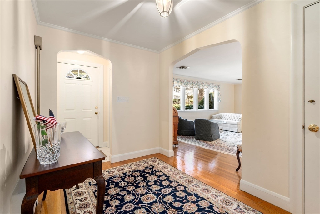 3 Tower Road Lexington, MA 02421 - Photo 7 of 38 a bedroom with a bed and wooden floor