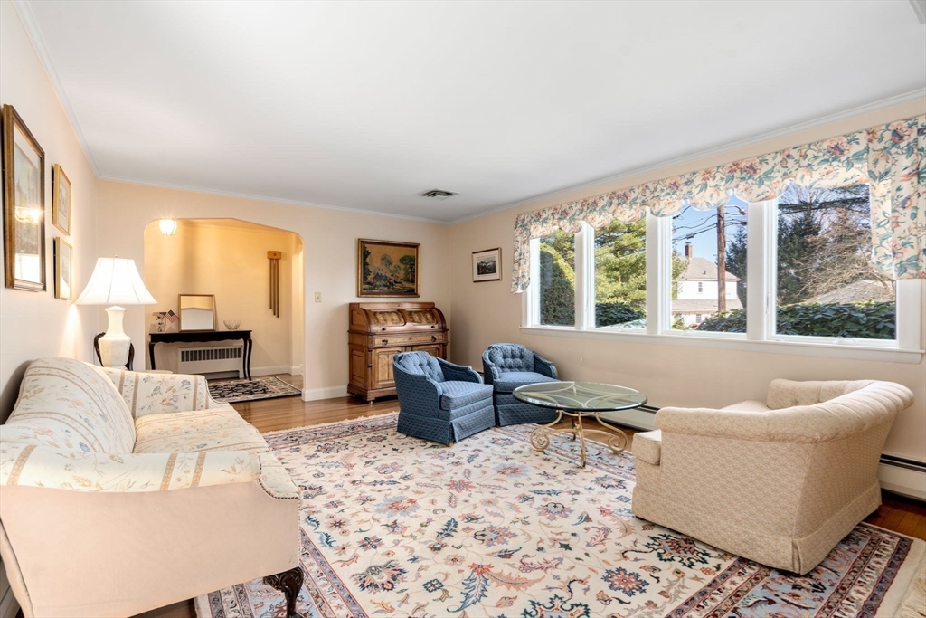 3 Tower Road Lexington, MA 02421 - Photo 8 of 38 a living room with furniture and large windows