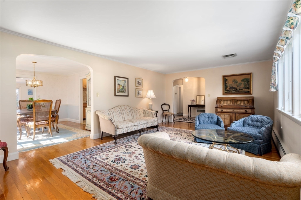 3 Tower Road Lexington, MA 02421 - Photo 9 of 38 a living room with furniture a rug and a table