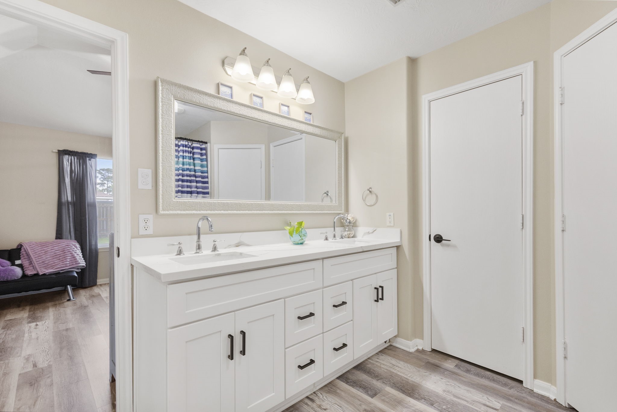 29106 Foxingham Circle Spring, TX 77386 - Photo 28 of 47 a bathroom with a double vanity sink and a mirror