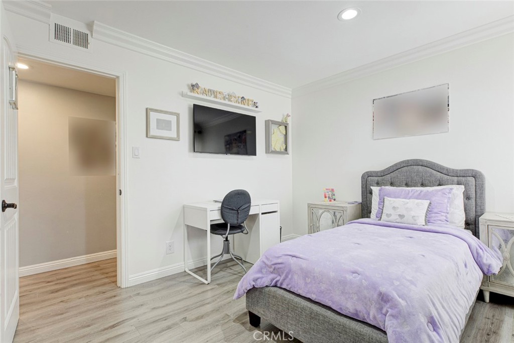9350 Rhea Avenue Northridge, CA 91324 - Photo 8 of 20 a bedroom with a bed a desk and chair