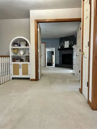 a view of empty room with a fireplace