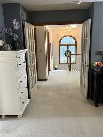 a view of a livingroom with furniture and entryway