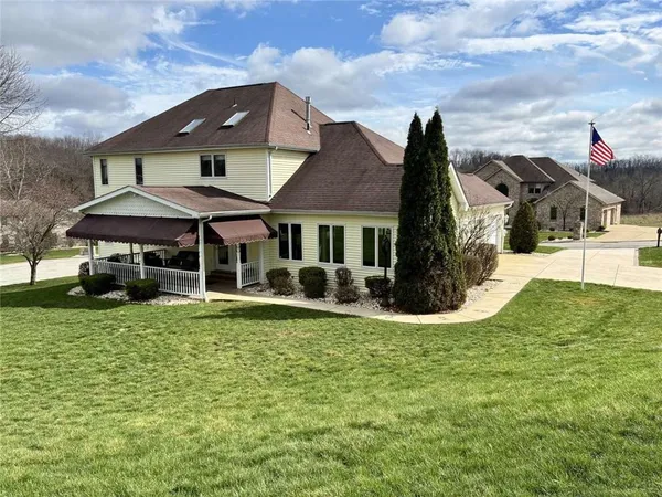 a front view of a house with a yard