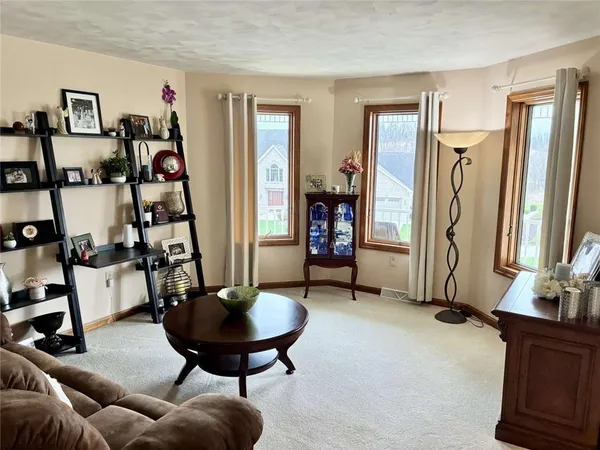 a view of a livingroom with furniture and a flat screen tv