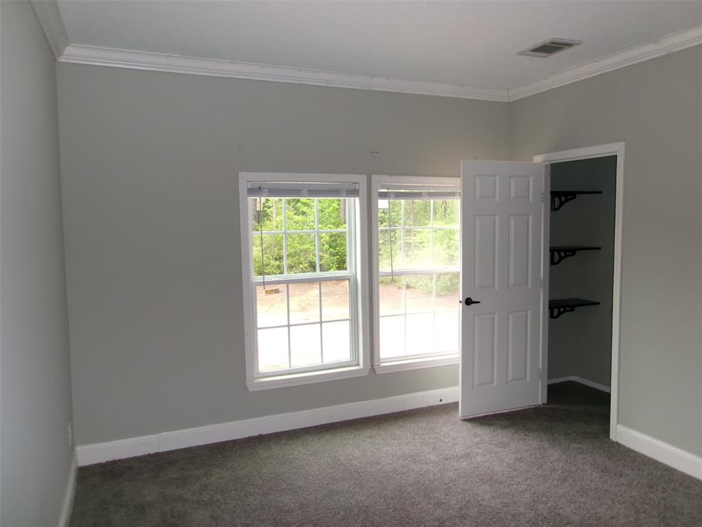 810 Williams Road Converse, LA 71419 - Photo 13 of 15 an empty room with windows and closet