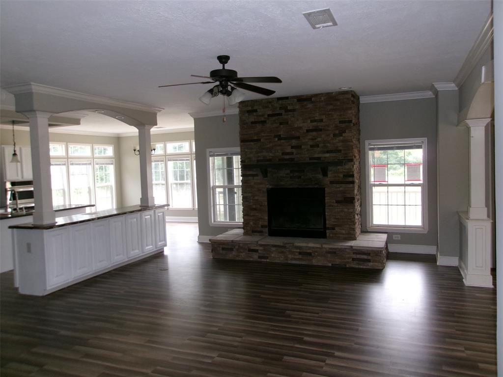 810 Williams Road Converse, LA 71419 - Photo 3 of 15 a living room with furniture wooden floor and a fireplace