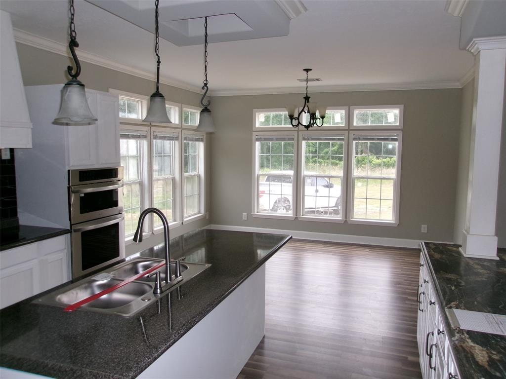 810 Williams Road Converse, LA 71419 - Photo 5 of 15 a kitchen with sink a stove and cabinets