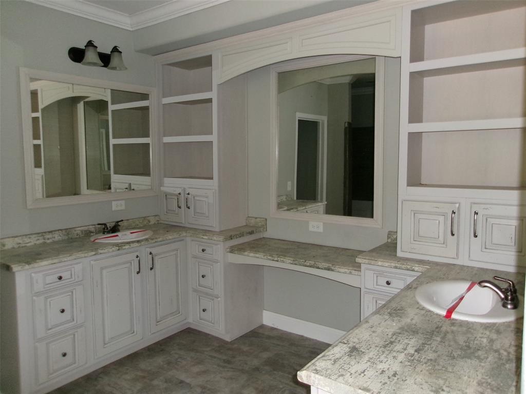 810 Williams Road Converse, LA 71419 - Photo 7 of 15 a spacious bathroom with a granite countertop sink and a mirror