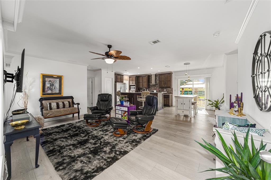4520 Northwest 95th Avenue Road Ocala, FL 34482 - Photo 19 of 87 a living room with furniture and wooden floor