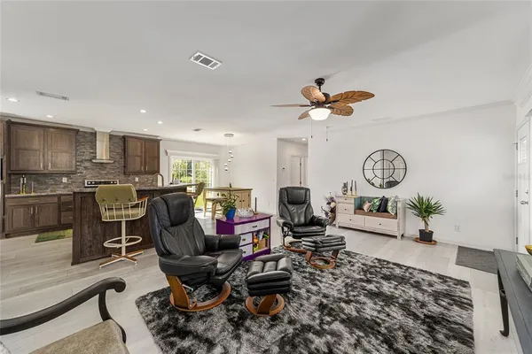a bedroom with a bed and a flat tv screen on dresser